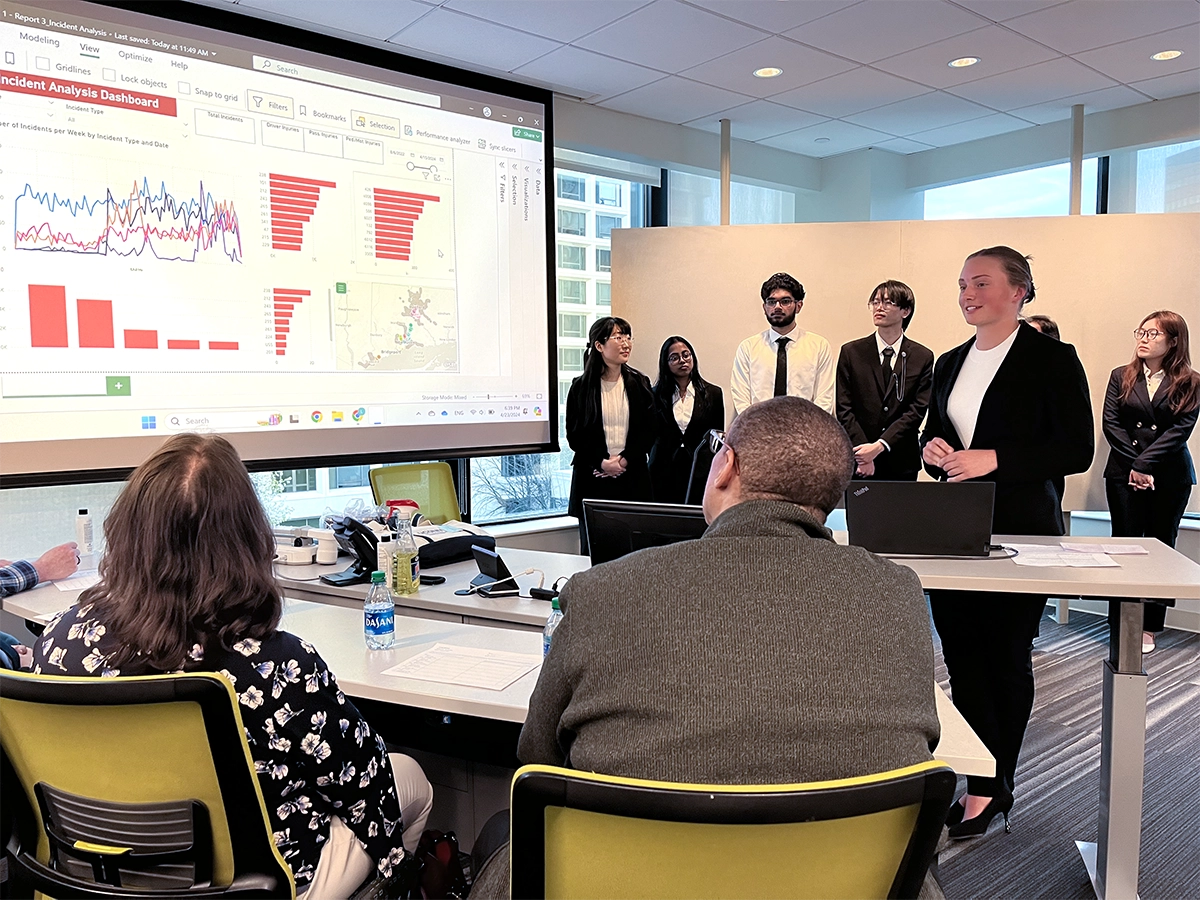 Business Analytics students giving presentation.
