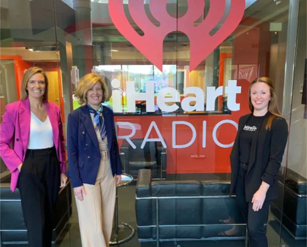 BAPM students in front iheart sign
